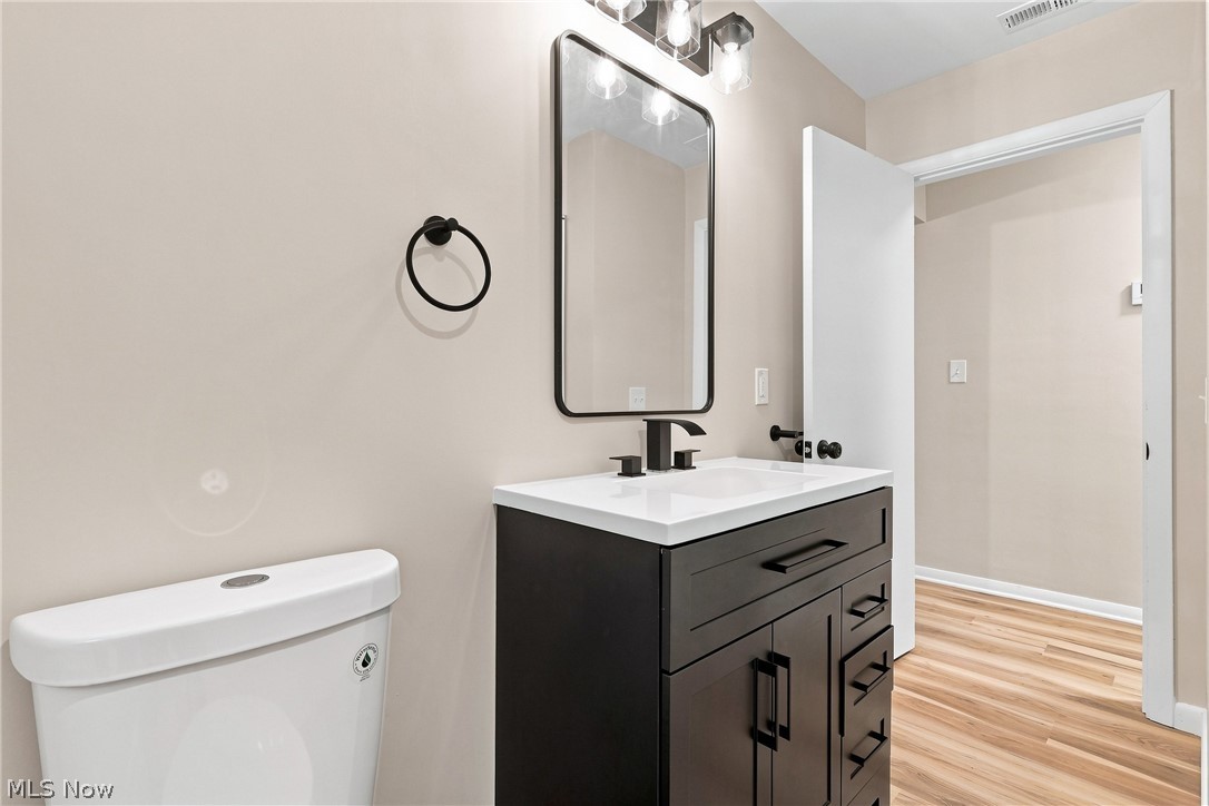 7524 Root Road North Ridgeville, OH 44039 - Photo 26 of 50 Modern vanity with black cabinetry, white countertop, and matte black fixtures
