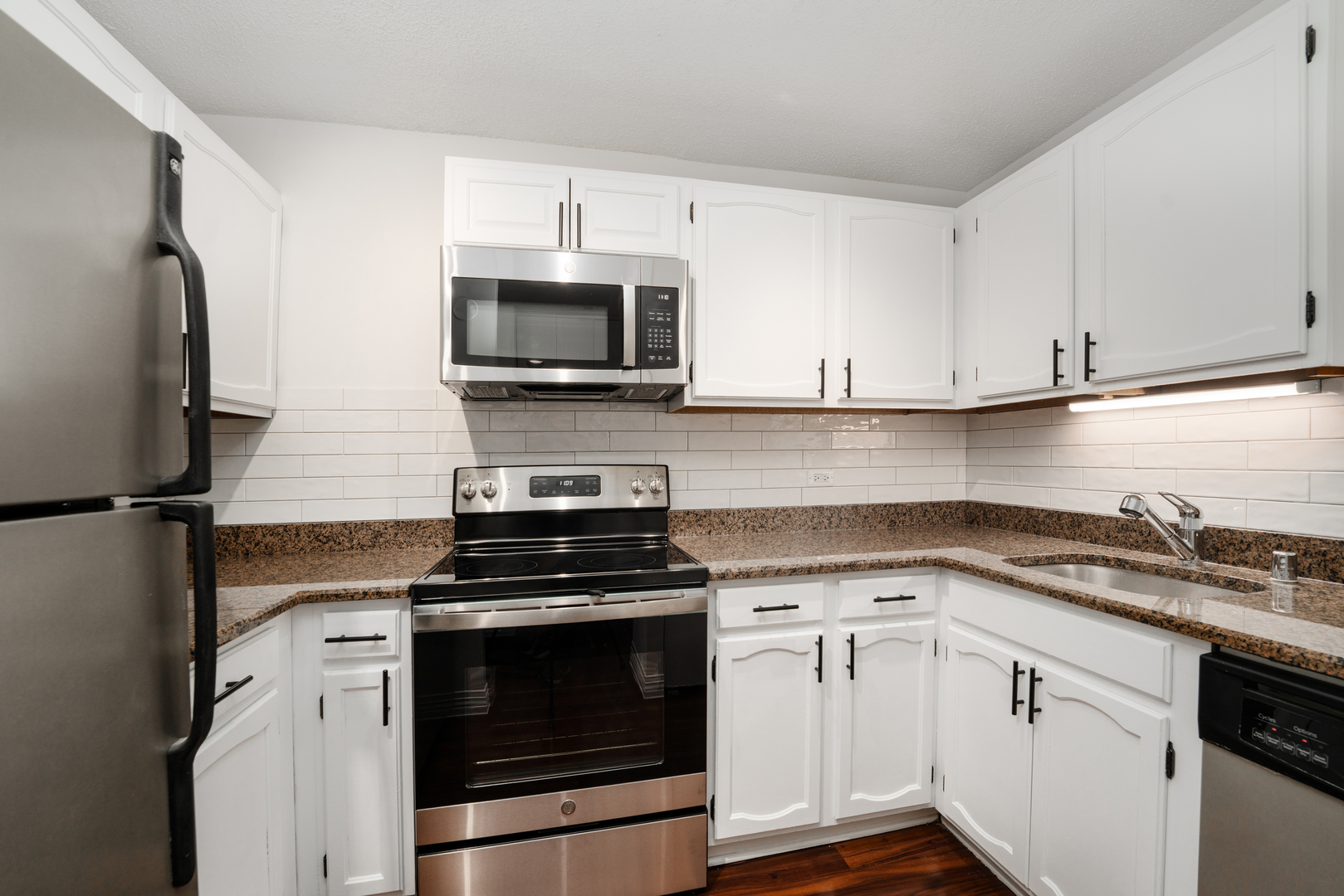 100 West Chestnut Street, Unit 503 Chicago, IL 60610 - Photo 13 of 18 a kitchen with cabinets stainless steel appliances and sink