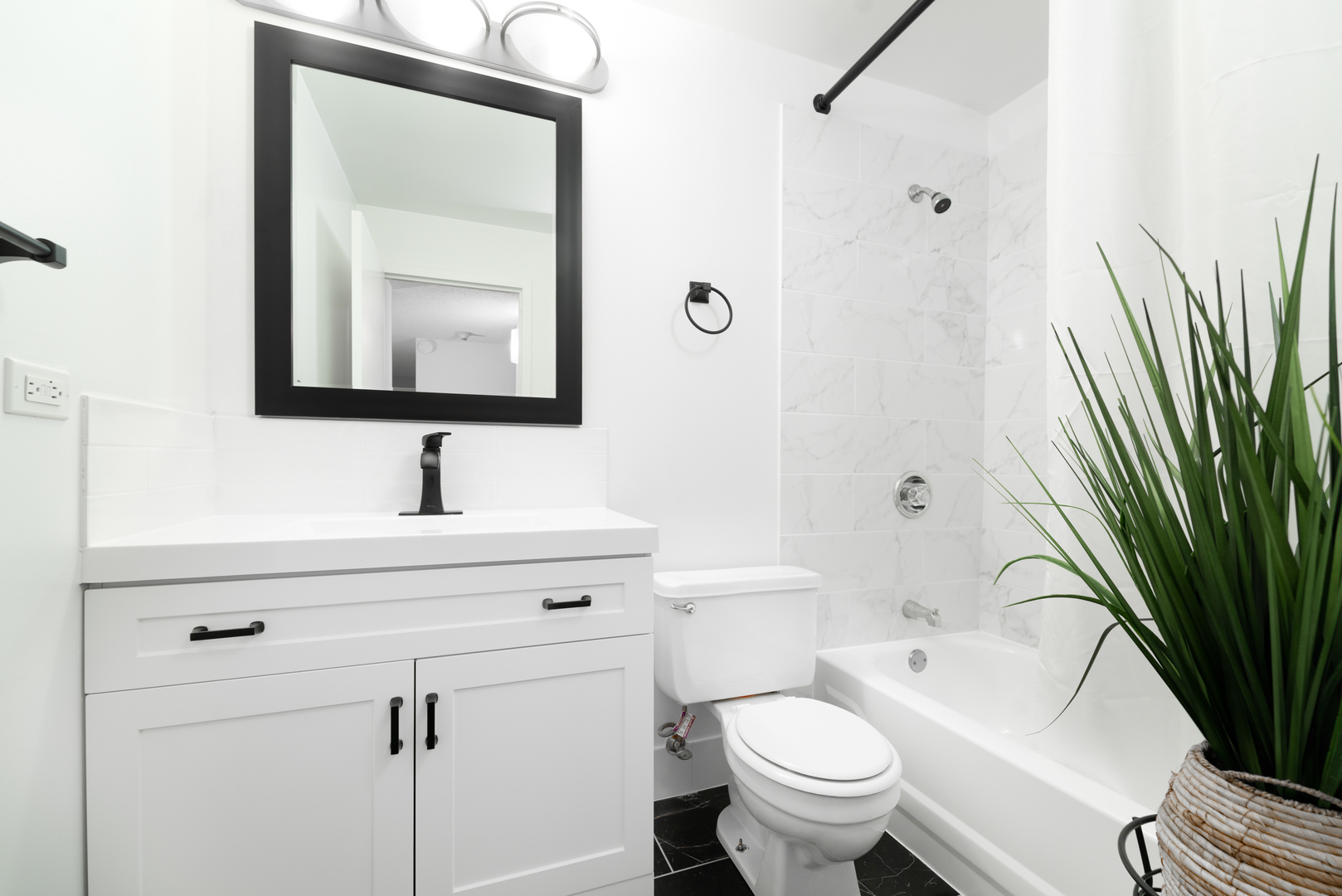 100 West Chestnut Street, Unit 503 Chicago, IL 60610 - Photo 18 of 18 a bathroom with a toilet a sink and a mirror