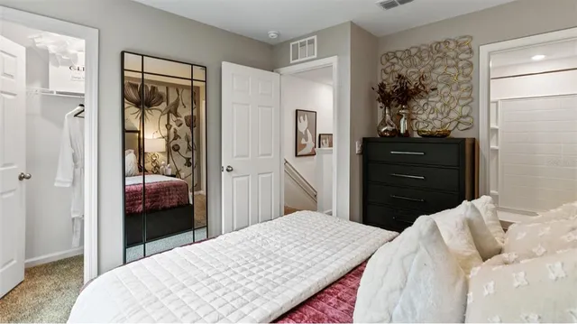 a bedroom with a bed and a closet