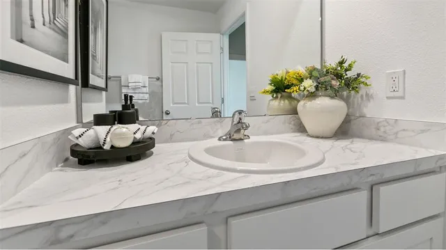 a bathroom with a sink and a mirror