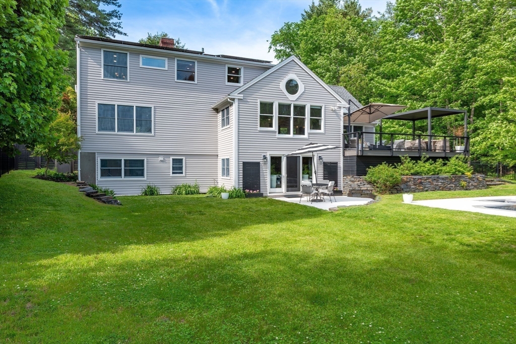 585 Station Road Amherst, MA 01002 - Photo 3 of 42 a front view of a house with a yard