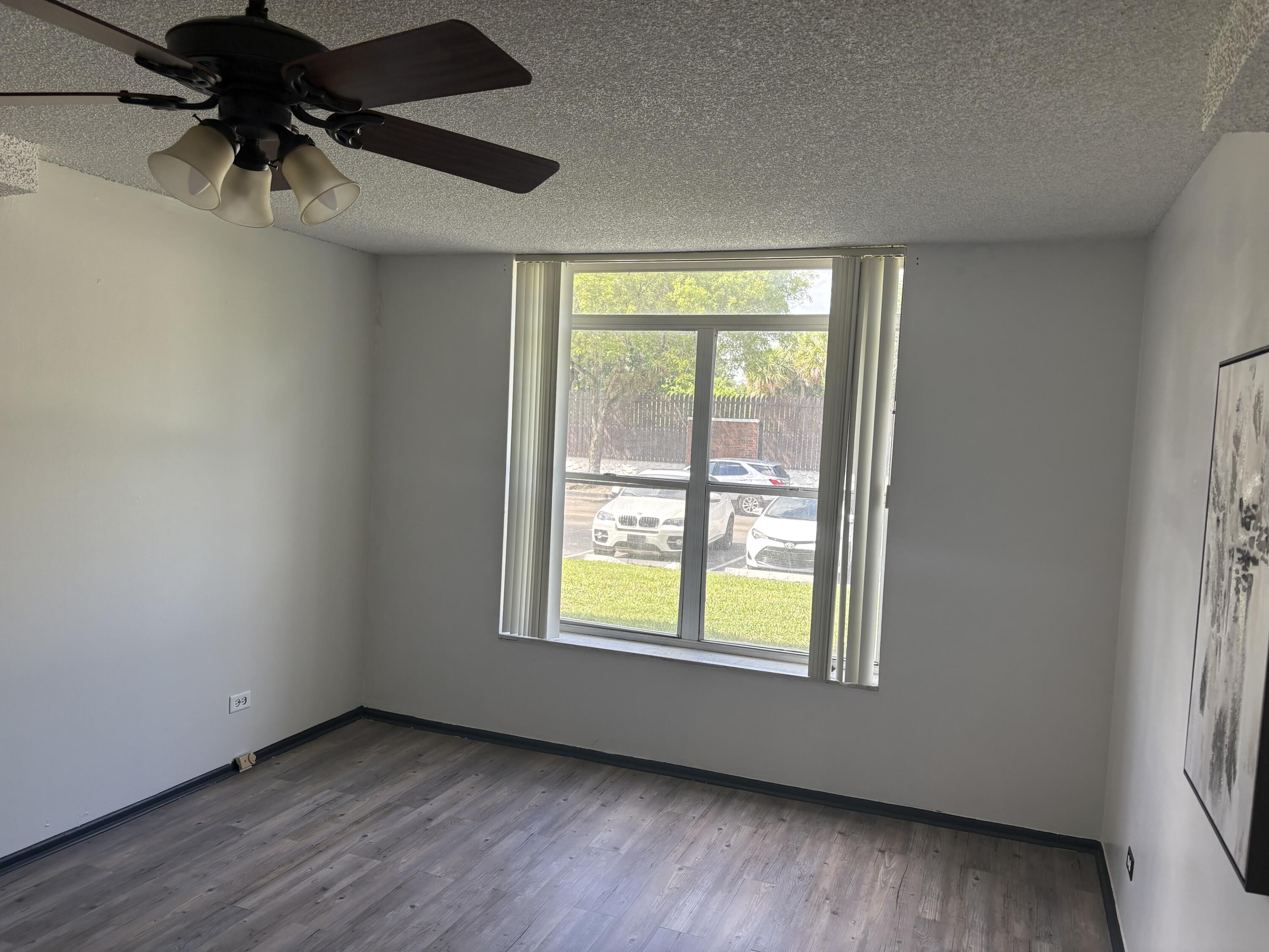 3660 Inverrary Drive, Unit 1B Lauderhill, FL 33319 - Photo 8 of 27 an empty room with a window