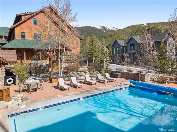 a view of pool with outdoor seating
