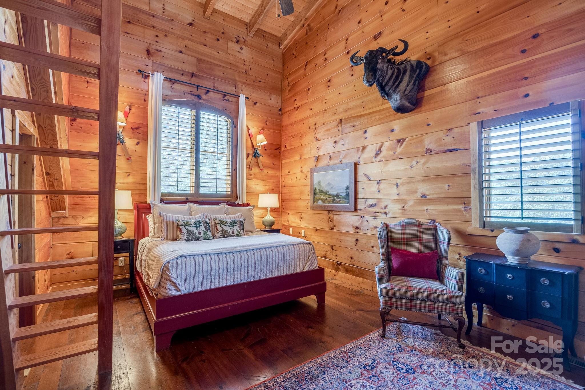 197 Smooth Rock Point Ridgeway, SC 29130 - Photo 29 of 48 a bedroom with a bed and wooden floor