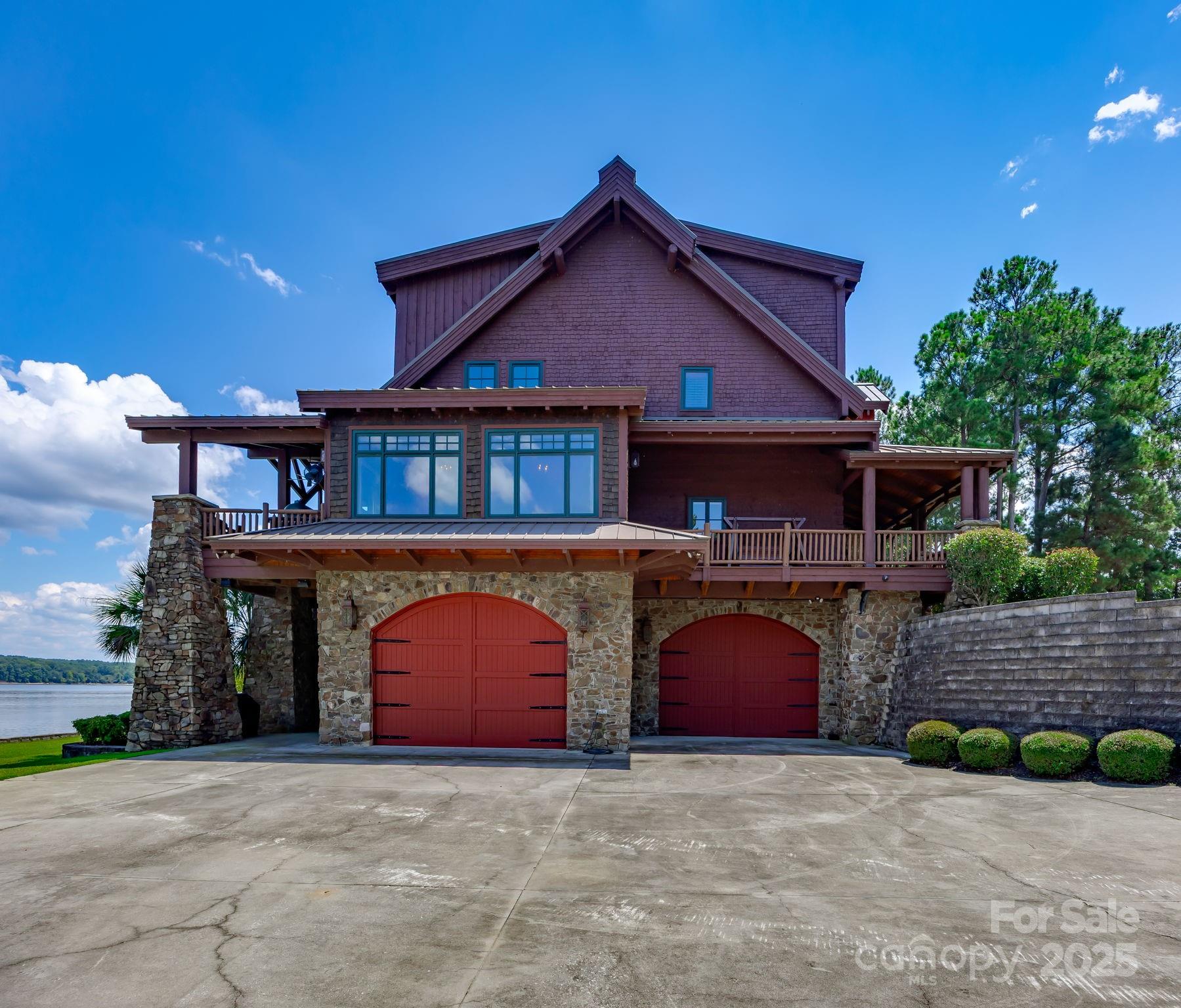 197 Smooth Rock Point Ridgeway, SC 29130 - Photo 3 of 48 a front view of a house with yard and parking