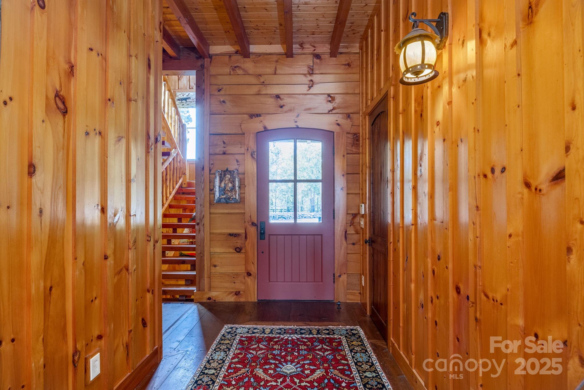 197 Smooth Rock Point Ridgeway, SC 29130 - Photo 5 of 48 a view of a hallway with wooden floor and a door