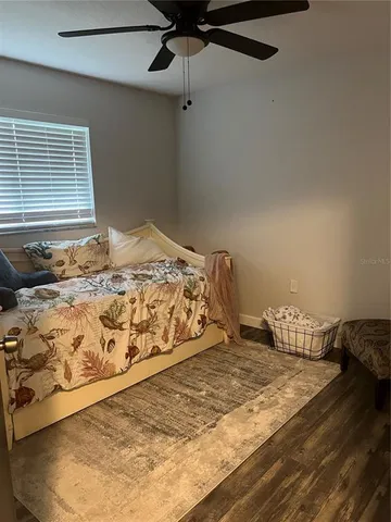 a bedroom with a bed and window