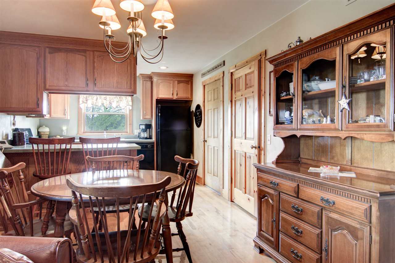 15232 Kelley Road Pecatonica, IL 61063 - Photo 12 of 24 a view of a dining room with furniture window and outside view