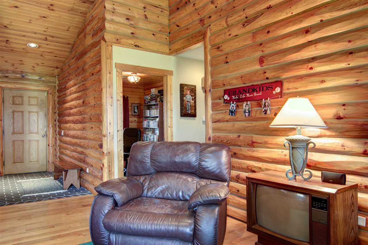 15232 Kelley Road Pecatonica, IL 61063 - Photo 6 of 24 a living room with furniture and a fireplace