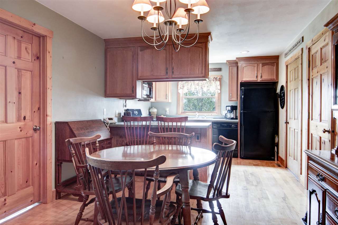 15232 Kelley Road Pecatonica, IL 61063 - Photo 8 of 24 a view of a dining room with furniture window and wooden floor