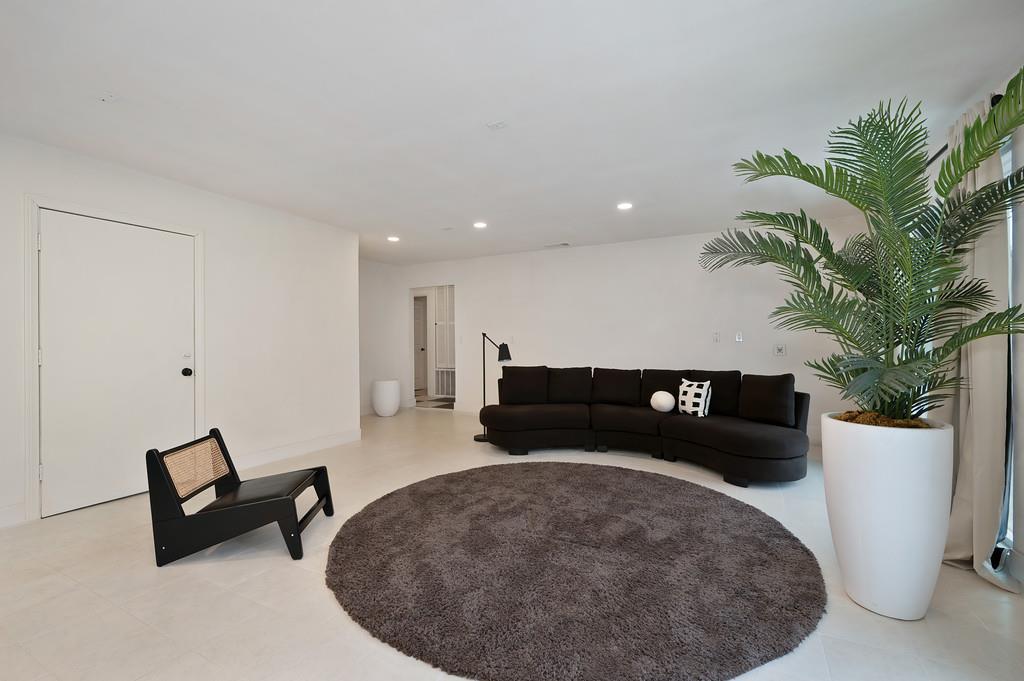 7011 Kemper Road Oakdale, CA 95361 - Photo 12 of 50 a living room with furniture and a potted plant