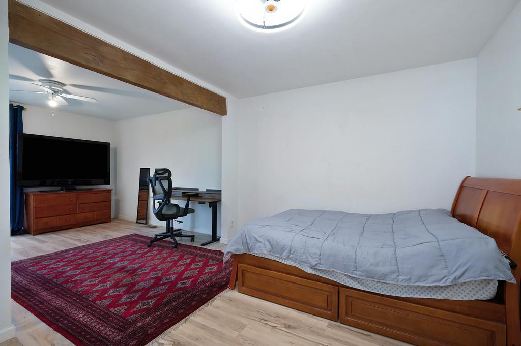 7011 Kemper Road Oakdale, CA 95361 - Photo 26 of 50 a bedroom with a bed and a flat screen tv