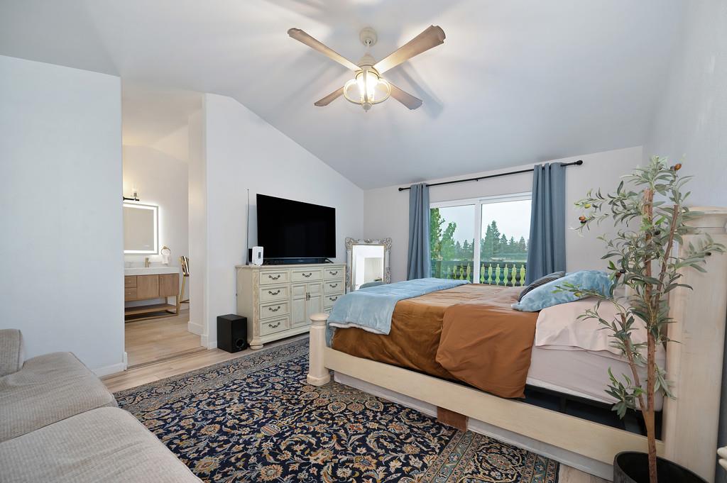7011 Kemper Road Oakdale, CA 95361 - Photo 27 of 50 a living room with furniture and a flat screen tv