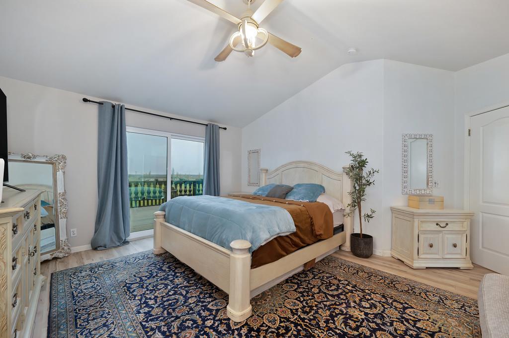 7011 Kemper Road Oakdale, CA 95361 - Photo 28 of 50 a bedroom with a bed and a window