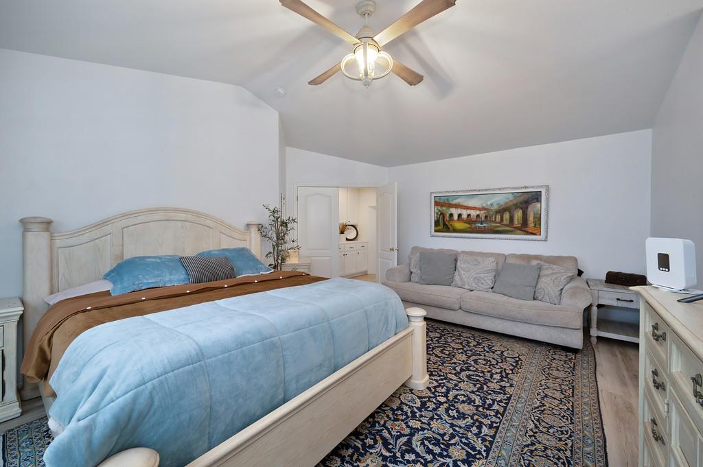 7011 Kemper Road Oakdale, CA 95361 - Photo 29 of 50 a bedroom with a bed and a couch