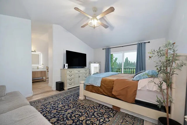 a bathroom with a tub a sink and mirror