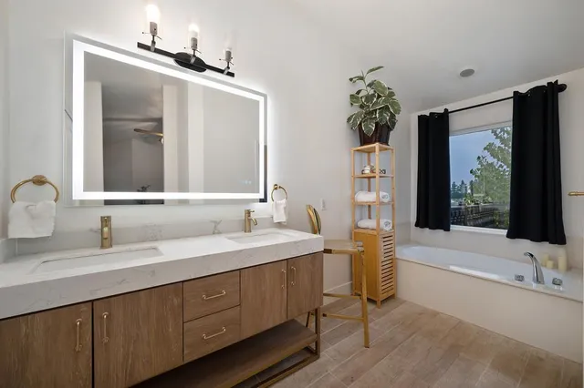 a view of a roof deck with chair and wooden floor