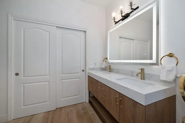 a view of a patio with table and chairs next to a yard