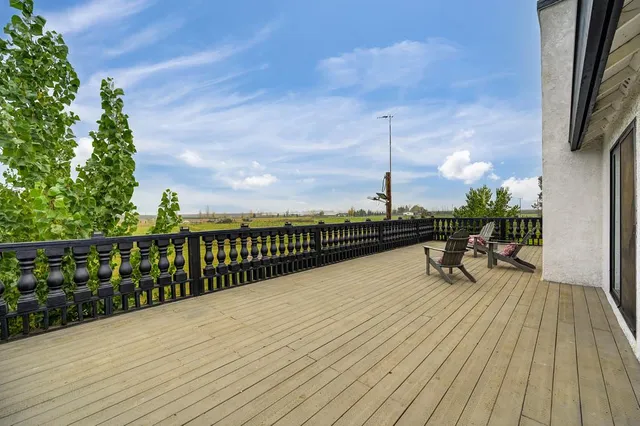 a view of a chairs and table in patio