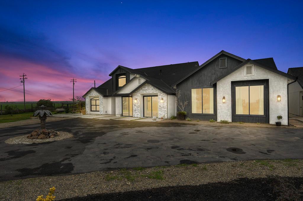 7011 Kemper Road Oakdale, CA 95361 - Photo 46 of 50 a front view of a house with a yard
