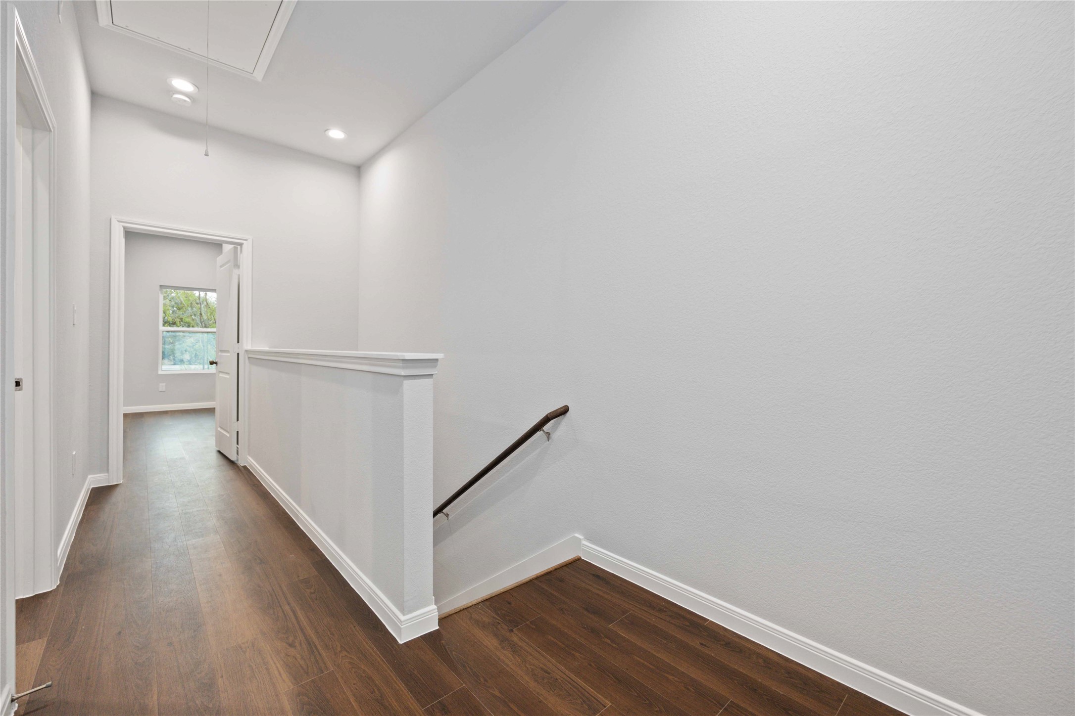 18831 Luminescent Ln Spring Spring, TX 77379 - Photo 18 of 36 a view of a hallway with wooden floor