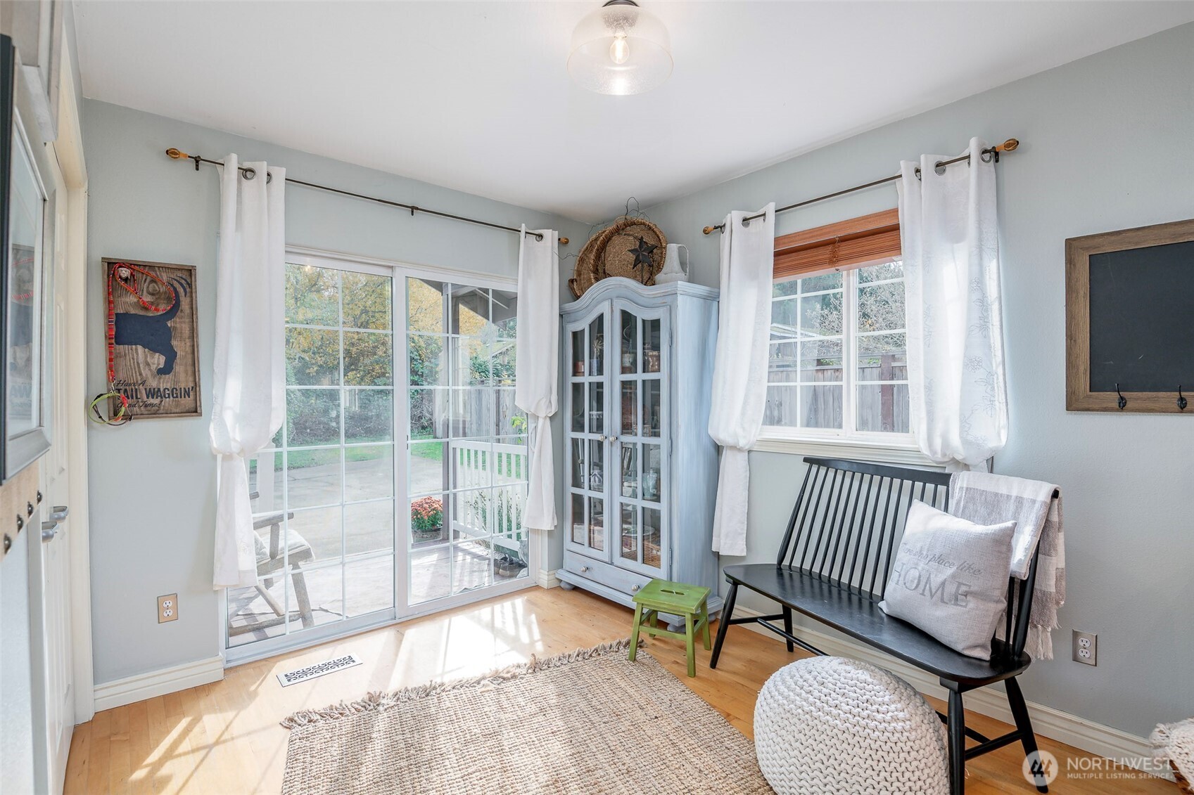 1310 Sequalish Street Steilacoom, WA 98388 - Photo 11 of 30 a living room with furniture and a floor to ceiling window