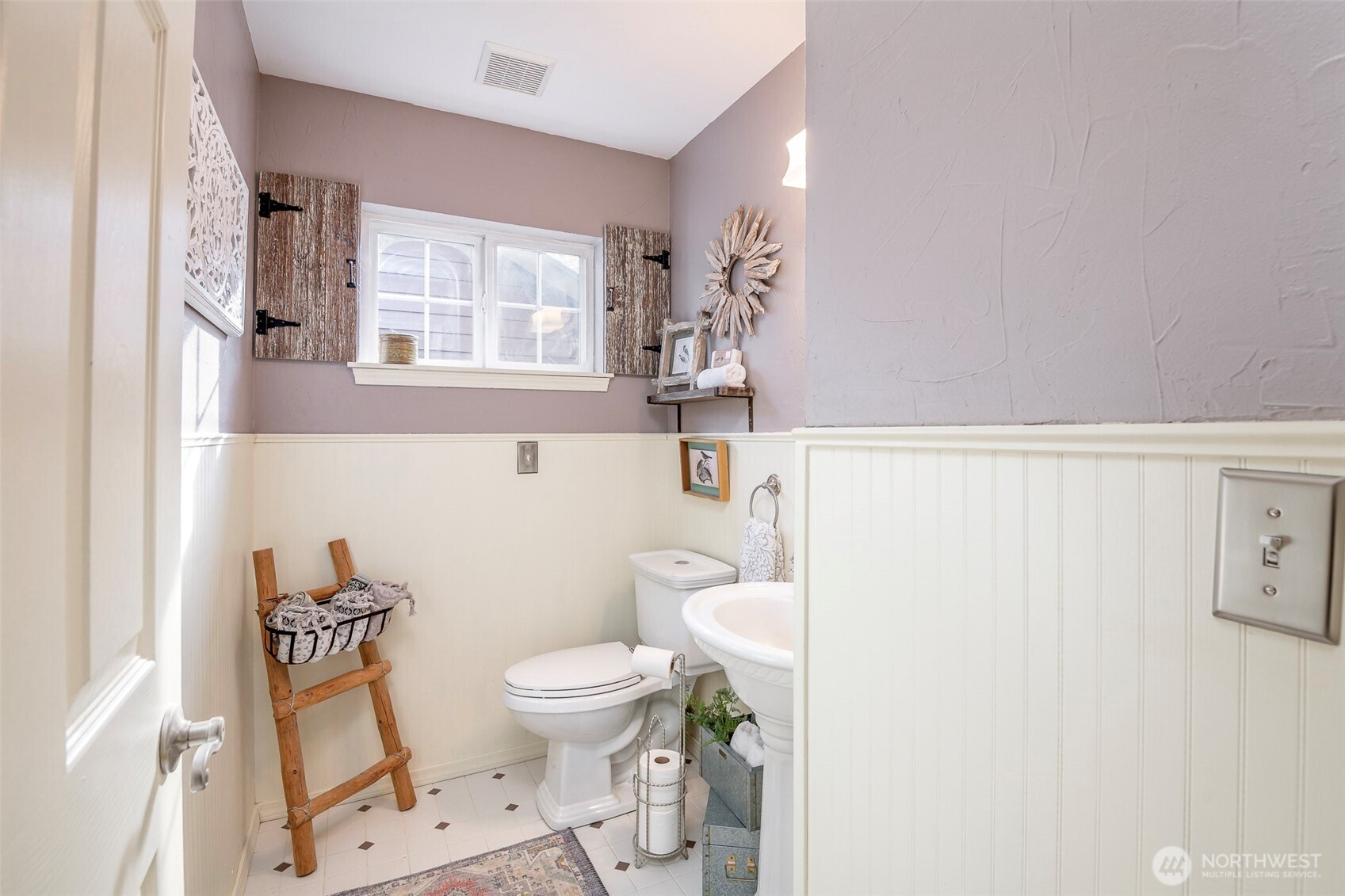 1310 Sequalish Street Steilacoom, WA 98388 - Photo 15 of 30 a white toilet sitting next to a bathroom sink