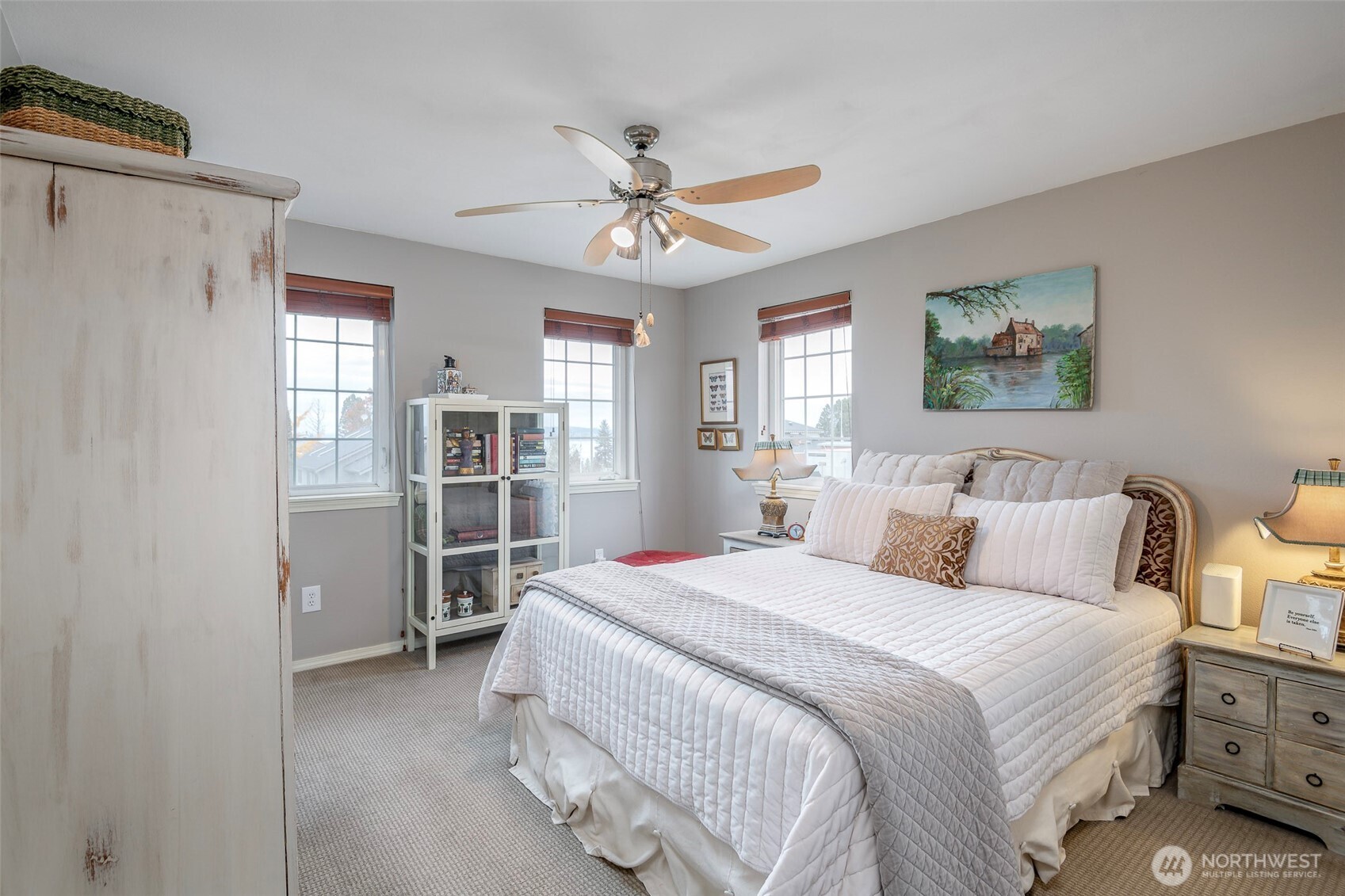1310 Sequalish Street Steilacoom, WA 98388 - Photo 16 of 30 a bedroom with a bed and a chandelier