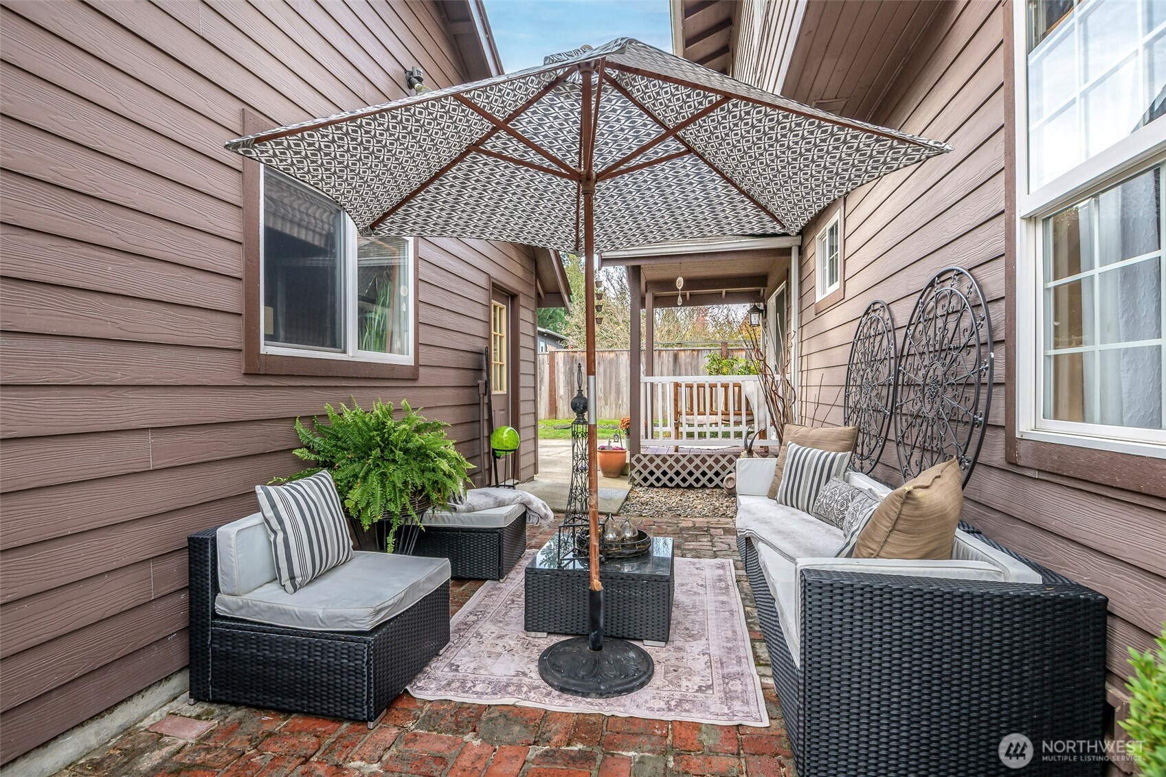 1310 Sequalish Street Steilacoom, WA 98388 - Photo 24 of 30 a view of a patio with couches chairs and a potted plant