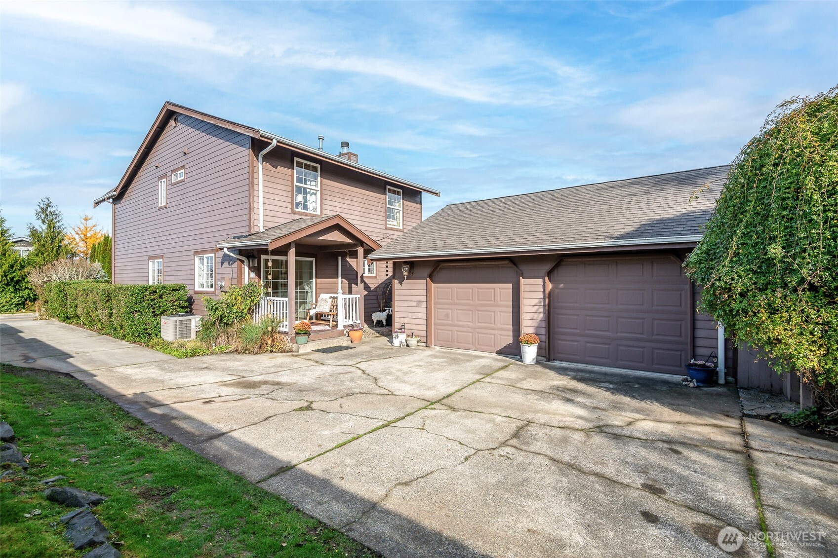 1310 Sequalish Street Steilacoom, WA 98388 - Photo 29 of 30 a front view of a house with a yard and garage