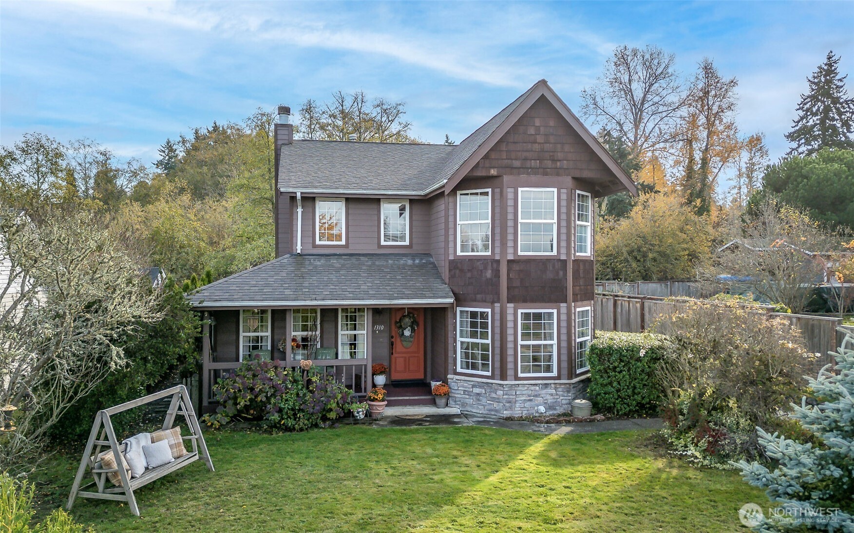 1310 Sequalish Street Steilacoom, WA 98388 - Photo 4 of 30 a front view of a house with a yard table and chairs