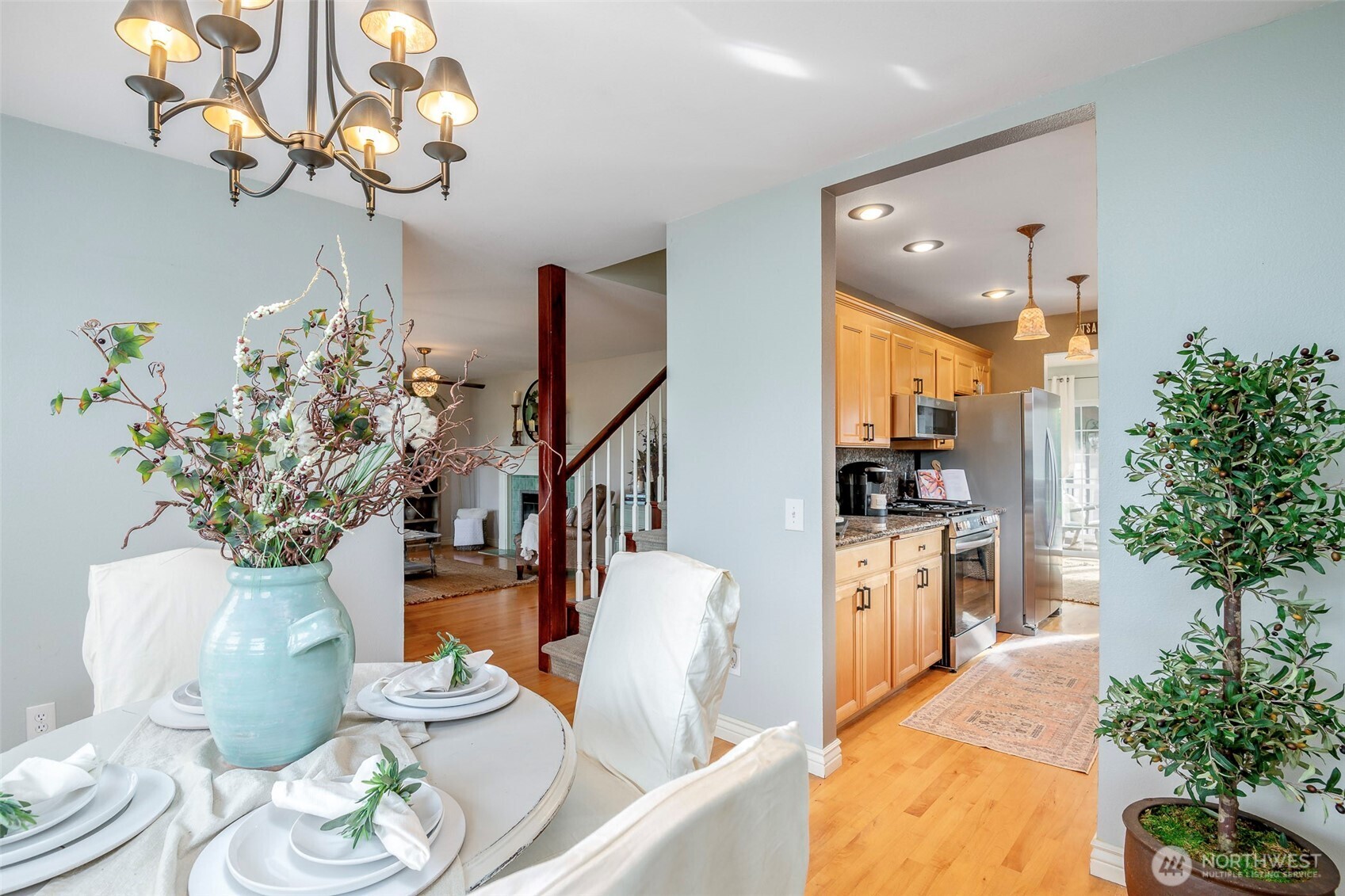1310 Sequalish Street Steilacoom, WA 98388 - Photo 6 of 30 a dining room with furniture a chandelier and wooden floor