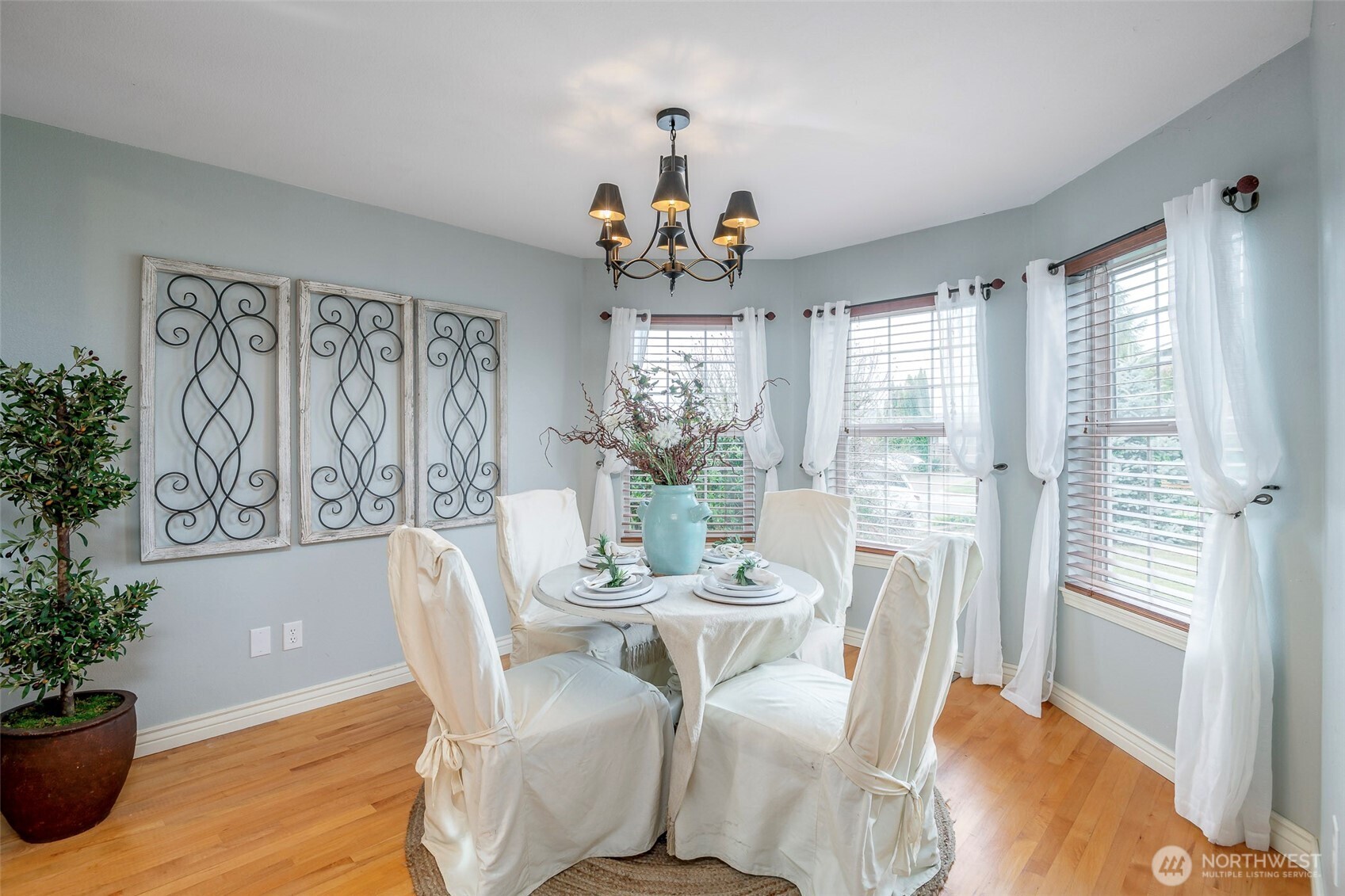 1310 Sequalish Street Steilacoom, WA 98388 - Photo 7 of 30 a view of a dining room with furniture wooden floor and a chandelier