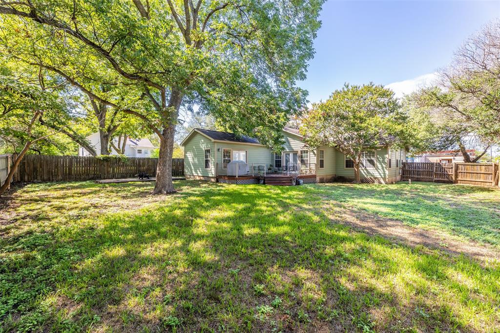 608 East 13th Street Georgetown, TX 78626 - Photo 21 of 22 a front view of a house with a yard