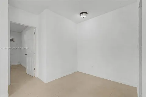 a view of a storage and utility room with washer and dryer