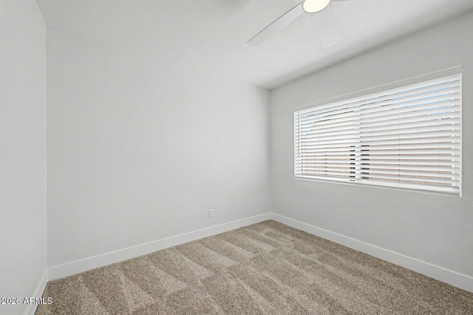 1009 West Pampa Avenue Mesa, AZ 85210 - Photo 20 of 31 an empty room with a window