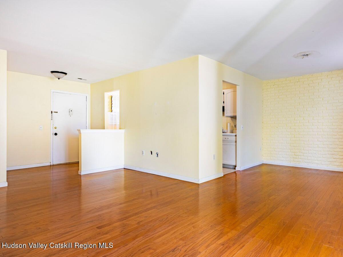 902 Commons Way, Unit B Fishkill, NY 12524 - Photo 11 of 24 a view of empty room with wooden floor