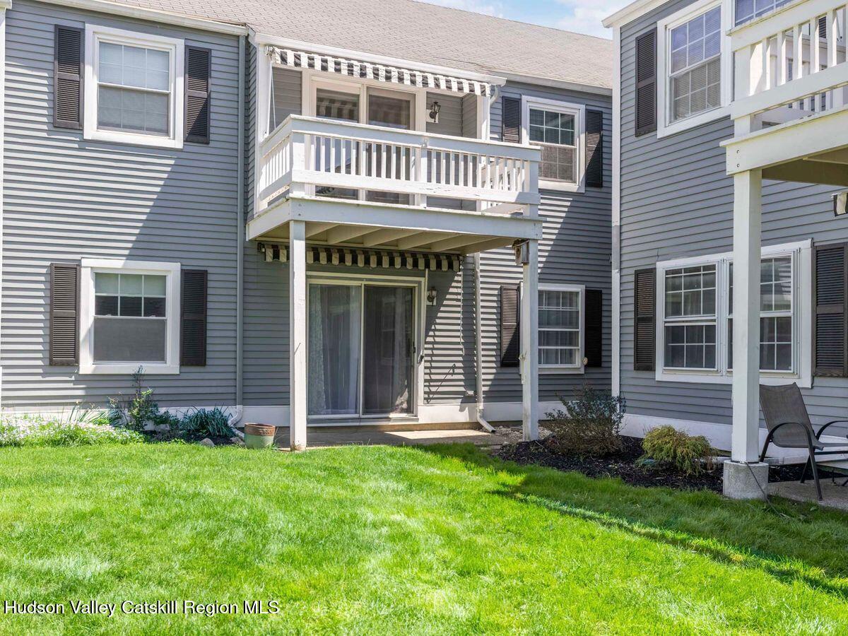 902 Commons Way, Unit B Fishkill, NY 12524 - Photo 2 of 24 a front view of a house with a yard