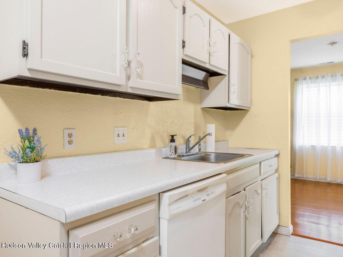 902 Commons Way, Unit B Fishkill, NY 12524 - Photo 8 of 24 a kitchen with stainless steel appliances white cabinets and a sink