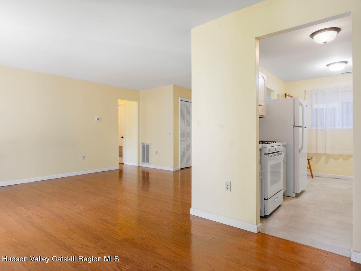 902 Commons Way, Unit B Fishkill, NY 12524 - Photo 10 of 24 a view of a kitchen with a sink and a refrigerator