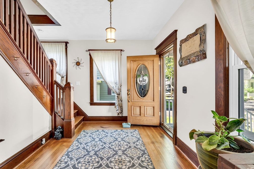 27 Powell Avenue Springfield, MA 01118 - Photo 4 of 34 a view of front door with wooden floor