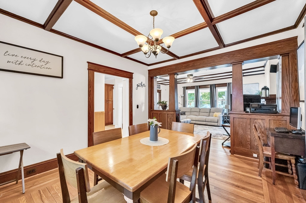 27 Powell Avenue Springfield, MA 01118 - Photo 10 of 34 a dining room with furniture a chandelier and wooden floor