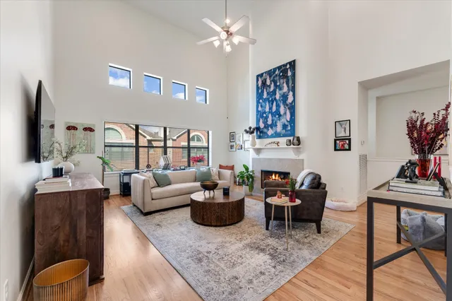 a living room with furniture a flat screen tv and a rug