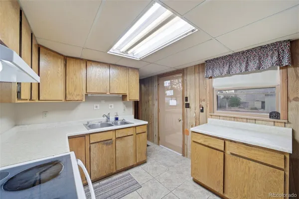 a room with a sink and cabinets