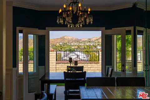 a view of a balcony with chairs