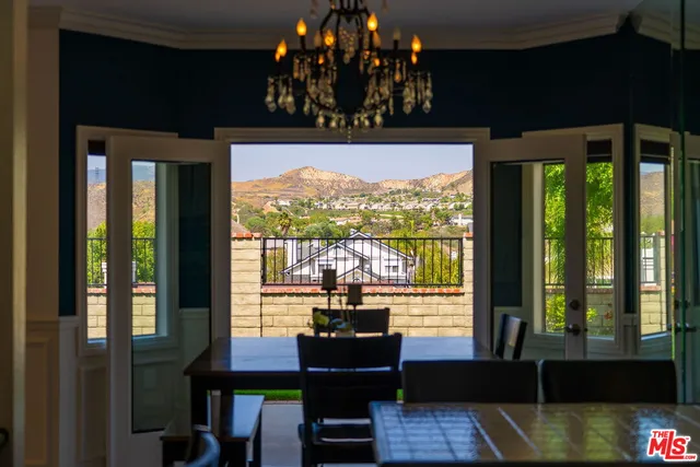 a view of a balcony with chairs