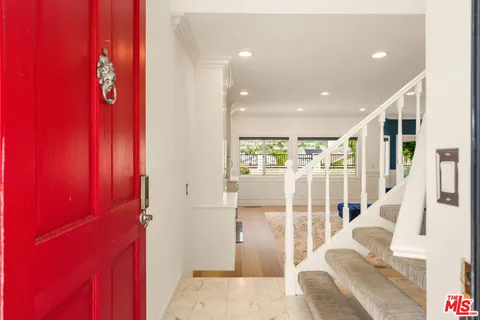 a view of entryway with wooden floor