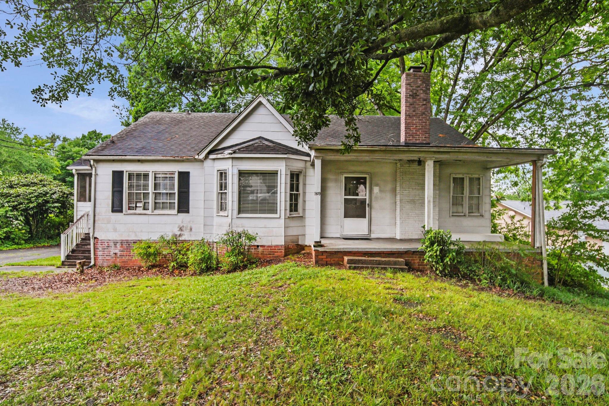 1109 Union Road Gastonia, NC 28054 - Photo 2 of 44 a front view of a house with garden