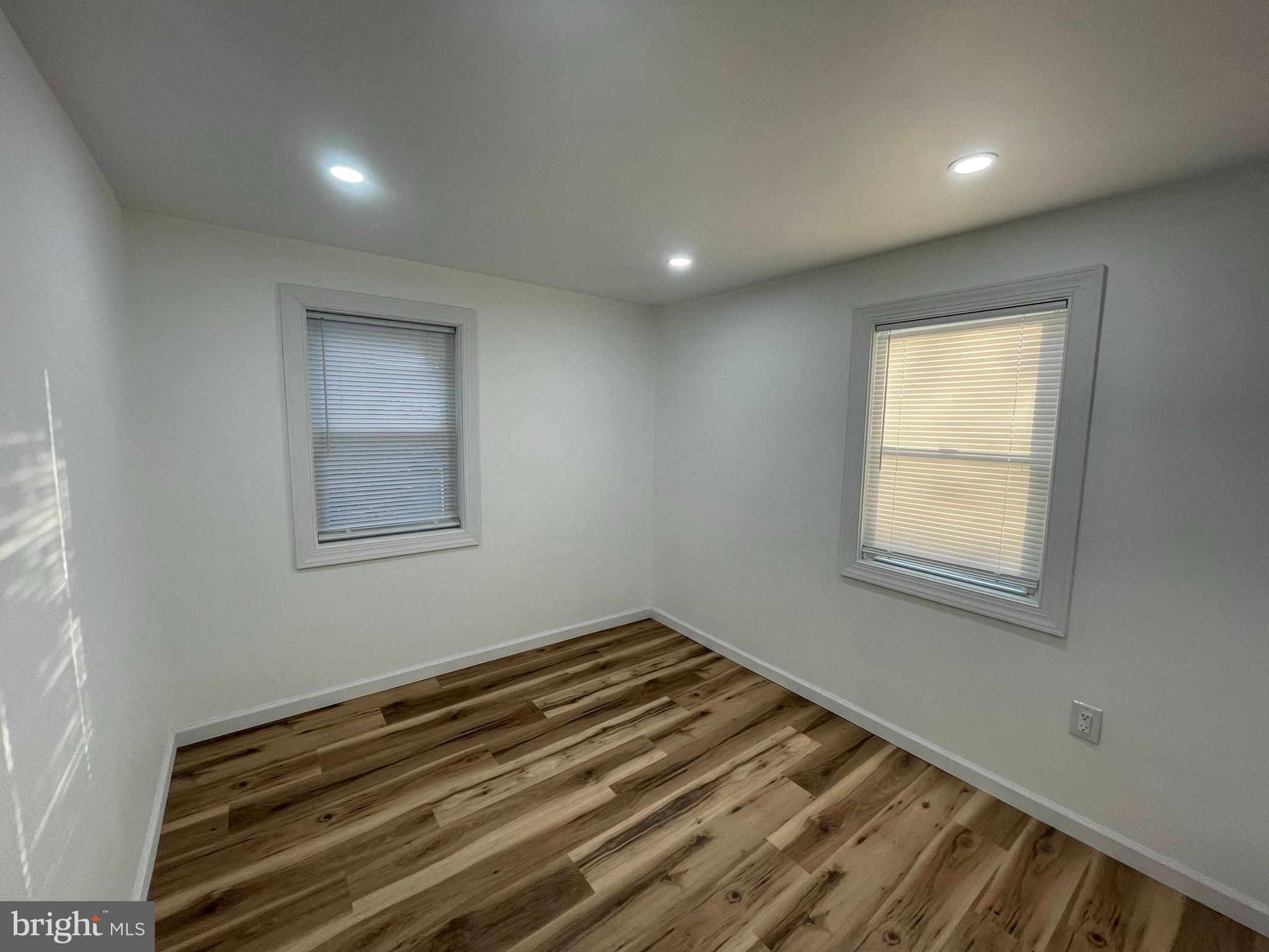 628-630 High Street Cambridge, MD 21613 - Photo 13 of 16 a view of a room with wooden floor and window